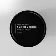 Amber + Moss Scented Candle in Black Travel Tin